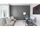 Cozy office space with a glass desk, comfortable seating, and a large window for natural light at 134 Rustling Waters Dr, Mooresville, NC 28117
