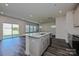 Contemporary kitchen island with sink, stainless appliances, and dark plank flooring at 1350 31St St, Conover, NC 28613