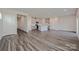 Open living space with plank flooring, connecting kitchen and dining area at 1350 31St St, Conover, NC 28613