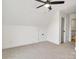 Clean upper bedroom with carpet, high ceilings, with a door leading to additional spaces in the home at 1500 Nectar Way # 32, Kannapolis, NC 28083