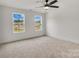 Spacious bedroom with two windows and carpet flooring at 1500 Nectar Way # 32, Kannapolis, NC 28083