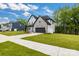 New construction home with a stone and siding exterior and a two car garage at 1500 Nectar Way # 32, Kannapolis, NC 28083