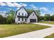 Beautiful two-story home with a stone and siding exterior, black accents, and a lush green lawn at 1500 Nectar Way # 32, Kannapolis, NC 28083