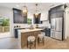 Contemporary kitchen featuring an island with seating, dark cabinets, and stainless steel appliances at 1500 Nectar Way # 32, Kannapolis, NC 28083