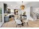 Open kitchen with dark cabinets, stainless steel appliances, and a dining area at 1500 Nectar Way # 32, Kannapolis, NC 28083