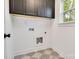 This laundry room features upper cabinets and a patterned floor at 1500 Nectar Way # 32, Kannapolis, NC 28083