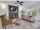 Cozy living room with a fireplace, ceiling fan, comfortable seating, and lots of natural light at 1500 Nectar Way # 32, Kannapolis, NC 28083