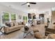 Open-concept living area with a kitchen view, comfortable seating, and lots of natural light at 1500 Nectar Way # 32, Kannapolis, NC 28083