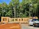 New home construction featuring a foundation and wood frame set against a backdrop of mature trees at 155 Putney Ct, Salisbury, NC 28147