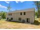 The exterior features a two story home and a spacious backyard with trees at 1604 Breezewood Dr, Charlotte, NC 28262