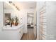 Well-lit bathroom with a double vanity, shower, and neutral tones at 1604 Breezewood Dr, Charlotte, NC 28262