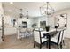Open-concept kitchen featuring stainless steel appliances, modern cabinetry, and eat-in island at 1604 Breezewood Dr, Charlotte, NC 28262