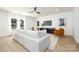Modern living room with comfortable white sofa, stylish decor, and bright natural light at 1604 Breezewood Dr, Charlotte, NC 28262