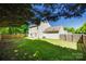 Spacious, green backyard perfect for outdoor activities, complemented by a well-maintained wooden fence at 1605 Tate Rd # 258, Rock Hill, SC 29732