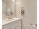 Bright bathroom features modern vanity with an oval mirror and floral accents at 1605 Tate Rd # 258, Rock Hill, SC 29732