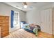 This cozy bedroom offers wood floors, a ceiling fan, and a large window for natural light at 1605 Tate Rd # 258, Rock Hill, SC 29732