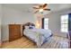 Cozy bedroom with ceiling fan, wood dresser and natural light at 1605 Tate Rd # 258, Rock Hill, SC 29732