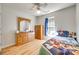 Cozy bedroom with hardwood floors, complemented by wooden furniture and bright natural light at 1605 Tate Rd # 258, Rock Hill, SC 29732
