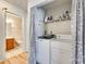 A practical laundry area with modern appliances, efficient shelving, and a connecting bathroom at 1605 Tate Rd # 258, Rock Hill, SC 29732