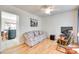 Cozy living room featuring hardwood floors, a ceiling fan, and plenty of natural light at 1605 Tate Rd # 258, Rock Hill, SC 29732