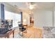 Bright living area with a large window, hardwood floors, and an open doorway at 1605 Tate Rd # 258, Rock Hill, SC 29732