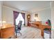 Well-lit office space featuring a large desk, piano, and hardwood floors at 1605 Tate Rd # 258, Rock Hill, SC 29732