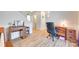 Home office area with great natural light, wainscotting, and wood-look flooring at 1605 Tate Rd # 258, Rock Hill, SC 29732