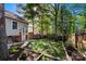 Grassy backyard featuring a wood fence, tasteful landscaping, and a beautiful tree line at 1631 Amanda Ln, Rock Hill, SC 29730