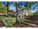 Large backyard with grass, trees, and a covered deck at 1631 Amanda Ln, Rock Hill, SC 29730