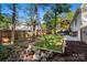 Landscaped backyard featuring mature trees and wood fence at 1631 Amanda Ln, Rock Hill, SC 29730
