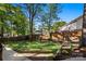 Spacious backyard with a lush lawn, wooden fence, and garden beds, perfect for outdoor living at 1631 Amanda Ln, Rock Hill, SC 29730