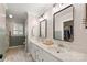 Modern bathroom with double vanity sinks, two mirrors, and natural light at 1631 Amanda Ln, Rock Hill, SC 29730