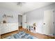 Bedroom featuring hardwood floors, a white dresser, a white storage unit, and cool gray walls at 1631 Amanda Ln, Rock Hill, SC 29730