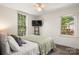 Primary bedroom with hardwood floors, two large windows, and neutral wall colors at 1631 Amanda Ln, Rock Hill, SC 29730