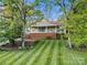 Charming home with a brick foundation, inviting front porch, and lush green lawn at 1631 Amanda Ln, Rock Hill, SC 29730