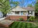 Inviting home featuring a classic front porch with flower boxes and manicured landscaping at 1631 Amanda Ln, Rock Hill, SC 29730