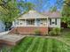 Beautifully maintained home with a classic front porch and well-kept front yard at 1631 Amanda Ln, Rock Hill, SC 29730