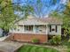 Attractive home featuring a welcoming front porch, complemented by a well-manicured lawn at 1631 Amanda Ln, Rock Hill, SC 29730