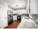 Well-lit kitchen featuring stainless steel appliances, white countertops and white cabinetry at 1631 Amanda Ln, Rock Hill, SC 29730