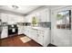 Bright kitchen featuring white cabinets, stainless steel appliances, and modern backsplash at 1631 Amanda Ln, Rock Hill, SC 29730