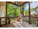 Spacious covered back porch offering a relaxing retreat with seating and scenic backyard views at 1631 Amanda Ln, Rock Hill, SC 29730