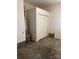 Unfinished basement space with a hot water heater, storage cabinet and closet with bi-fold doors at 165 Graceland Pl, Salisbury, NC 28146