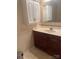 Bathroom featuring wood cabinetry, a sink with a large mirror, and storage space at 165 Graceland Pl, Salisbury, NC 28146