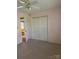 Bedroom featuring neutral carpet and closet with a ceiling fan for comfort at 165 Graceland Pl, Salisbury, NC 28146