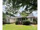 Exterior shot of a home with a screened in porch and large yard at 165 Graceland Pl, Salisbury, NC 28146