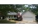 Charming home with a two-car garage and a cozy front porch nestled under mature trees at 165 Graceland Pl, Salisbury, NC 28146