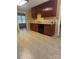 Kitchen featuring wood cabinets, a black dishwasher, and tiled floors at 165 Graceland Pl, Salisbury, NC 28146