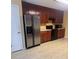 Functional kitchen with stainless steel appliances and warm wood cabinetry at 165 Graceland Pl, Salisbury, NC 28146