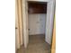 A basic laundry room with overhead cabinets and tile flooring at 165 Graceland Pl, Salisbury, NC 28146