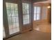 Bright living room with large windows and access to the patio area and a view to the eating area at 165 Graceland Pl, Salisbury, NC 28146
